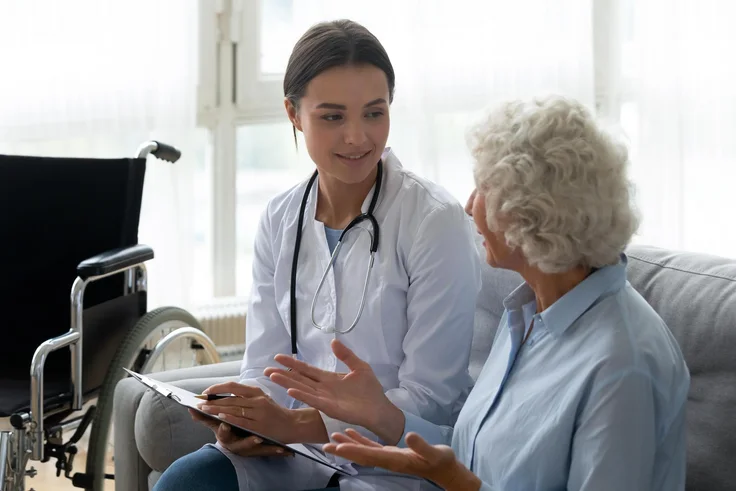 Healthcare providers consulting with a patient
